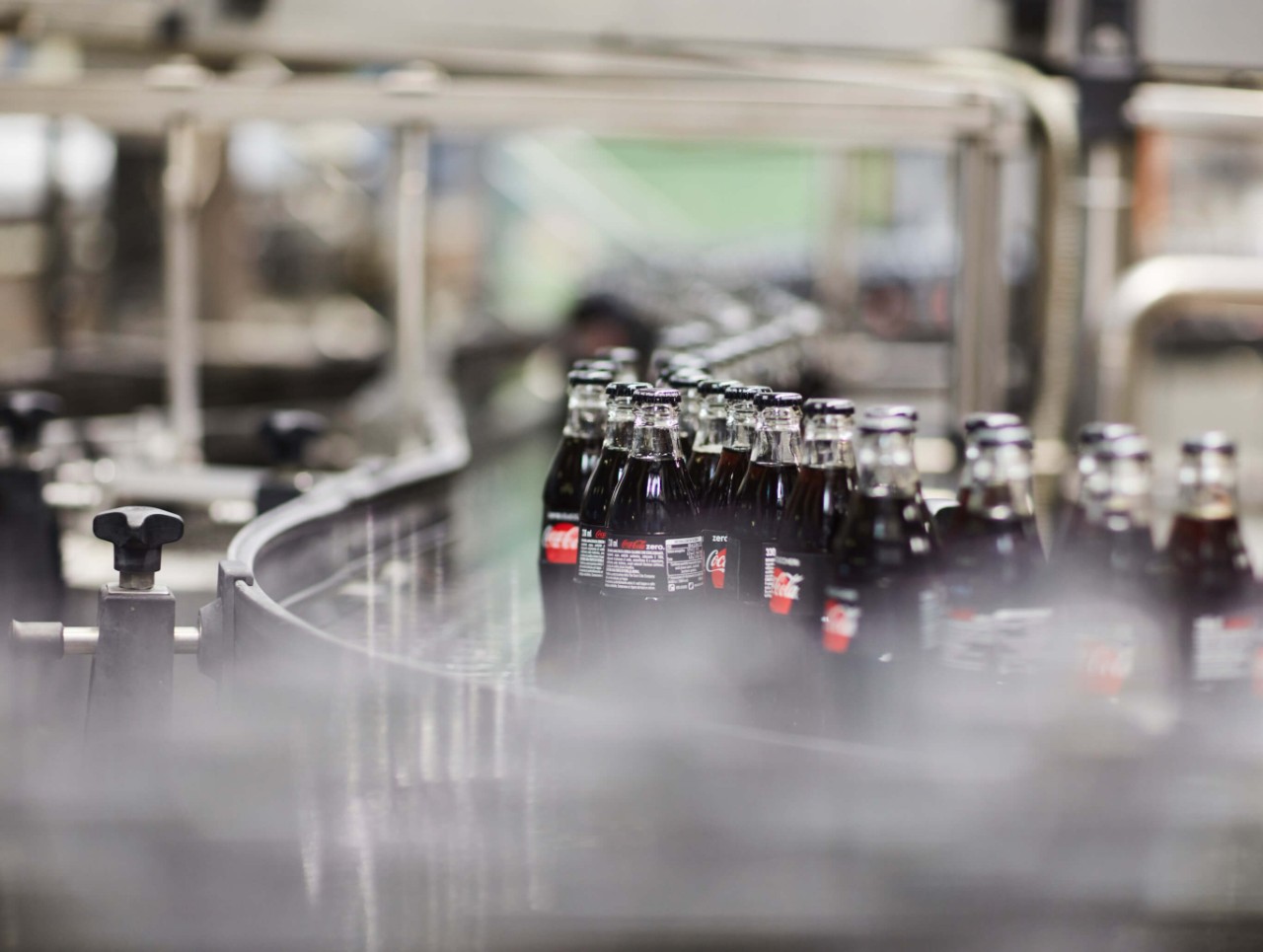 coca cola factory line with bottles